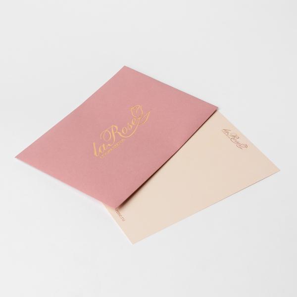 Postcard in a dusty pink envelope